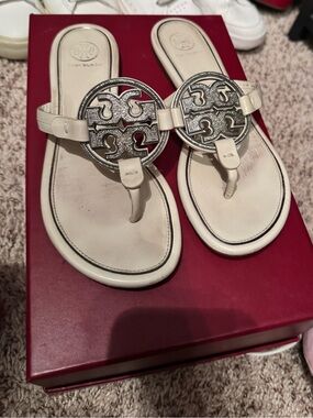 Tory Burch Cream Leather Logo Thong Sandals with Silver Medallions
